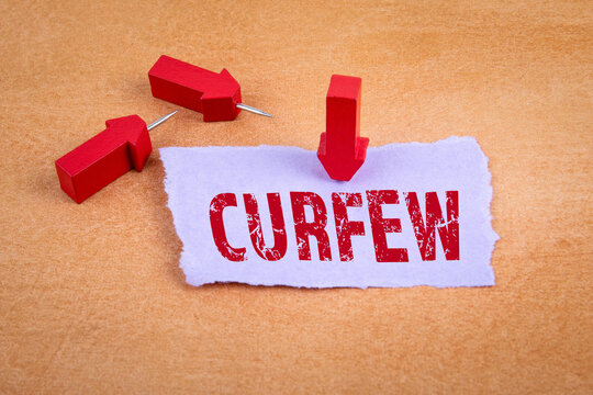 CURFEW. COVID-19, spread of the virus, state of emergency concept. Red arrows with pins