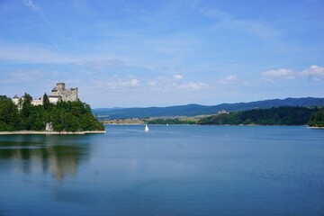 Lake Czorsztyn and medieval castle in Niedzica. The beauty of nature and architecture in Southern Poland. Medieval Castle in Niedzica, built in 14th century and artificial Czorsztyn Lake