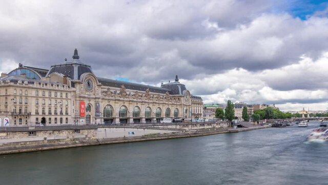 The musee d'Orsay is a museum in Paris timelapse hyperlapse, on the left bank of the Seine. View from Royal bridge. Musee d'Orsay has the largest collection of impressionist paintings in the world