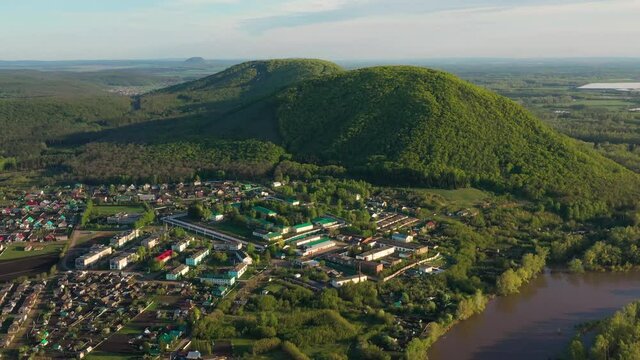 The remain of the reef of the ancient sea, composed of limestone - shikhan Kushtau on a spring day. Aerial view.
