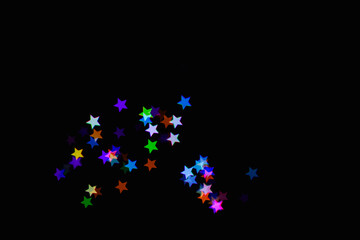 light colorful blue star little effect isolated overlay glitter texture on black.