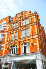 London, UK. Red brick buildings in Long Acre Street at City of Westminster. 