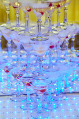 Crystal glasses for holiday, a lot of glasses for guests. Slide pyramid of glasses.