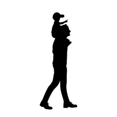 Silhouette of father carrying son on his shoulders
