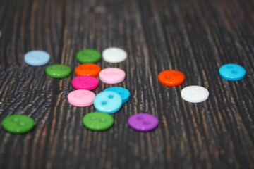 Colorfull button on a brown background