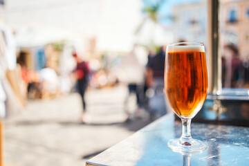 glass of beer background in bokeh