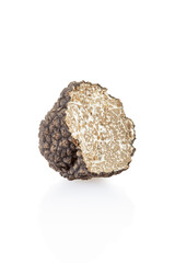 Black truffle section isolated on white, clipping path included