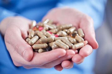 woman with different kinds of pills