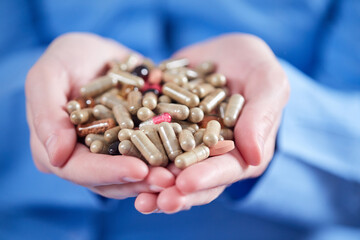 woman with different kinds of pills