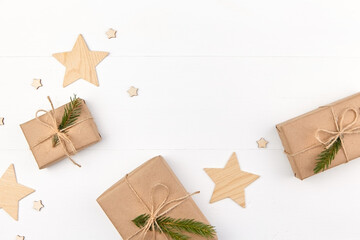 Christmas gift boxes with wooden stars on white background.