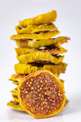 slices of dried figs on a white background. dried fruits. eco. macro.