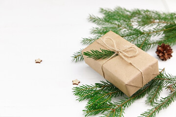 Fototapeta na wymiar Christmas composition - gift box with fir tree branches.