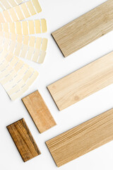 Wooden board floor and furniture samples with color scheme. Top view