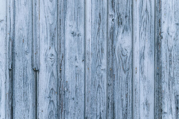 Texture of an old weathered wooden board with peeling paint. Vintage grunge background	