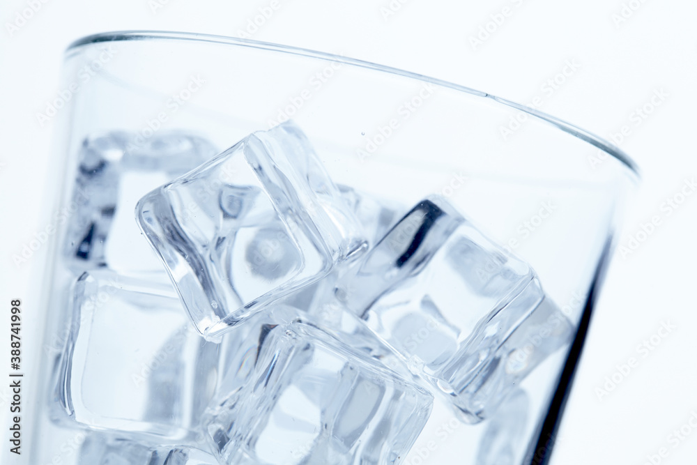 Sticker glass with ice cubes on white background