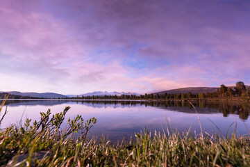 lake at sunset with reflections in norway