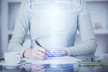 Double exposure of writing hand on background with data solution technology hologram. Ai concept.