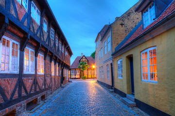 Street and houses in medieval Ribe town by night, Denmark - HDR