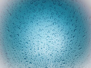 Close up texture water droplets raindrop on beautiful blue metallic background image for abstract background.