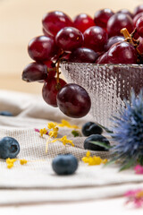 Detail of some red grapes on a crystal bowl