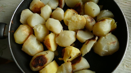 fried potatoes in a frying pan