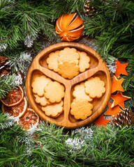 Christmas still life with homemade gingerbread cookies on wooden board