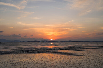 The mud flat where the sunset is reflected