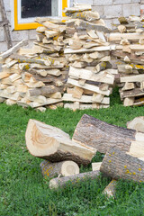 Harvesting and drying firewood for the winter in rural areas. Woodpile. Boxelder maple.
