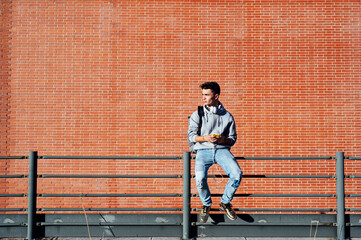 Profile of a happy guy using a smart phone