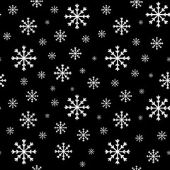Snow seamless background. Vector endless pattern: snowflakes on a black background.