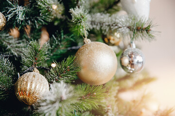 Obraz na płótnie Canvas Natural background Scandinavian Christmas tree with New Year decorations balls