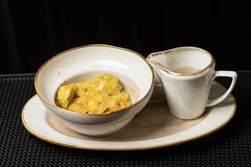 Fresh and hot dumplings with bouillon