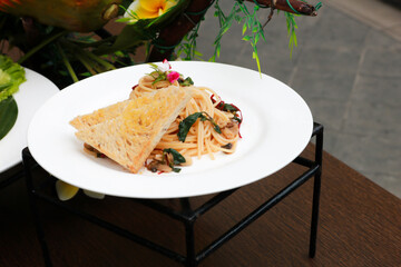 Delicious spaghetti served on a white plate