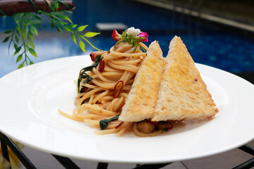 Delicious spaghetti served on a white plate