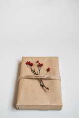 Holiday Gift Ideas. Sustainable Christmas, zero waste gifts, natural xmas decorations. Wrapping Christmas gifts in recycled brown paper. Vintage style Christmas packaging ideas
