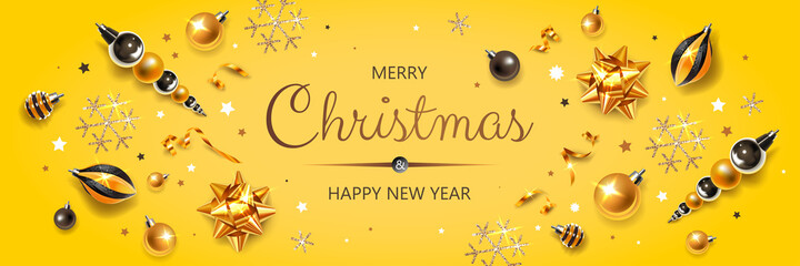 Horizontal banner with gold Christmas symbols and text. Christmas decor, balls, serpentine and snowflakes on yellow background.