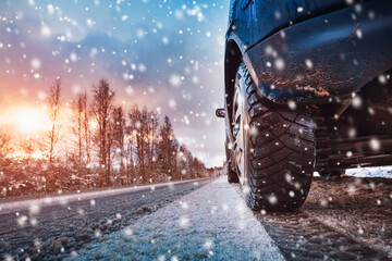Car tires on winter road covered with snow © candy1812