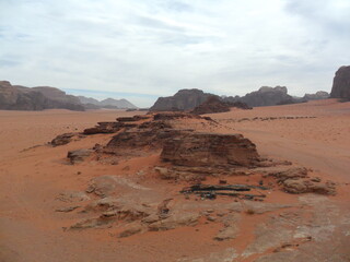 Hiking in the red desert sandcliffs and dunes of Wadi Rum in Jordan, Middle East