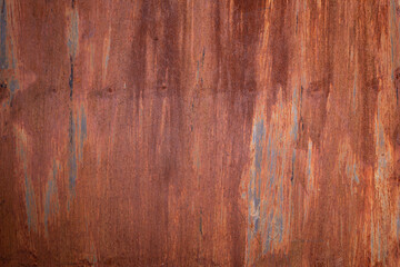 Background of a rusty metal sheet in orange and brown tones with space for text