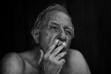 portrait of a smocking old man