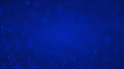 Christmas background of snowflakes of different shapes, sizes and transparency in blue colors