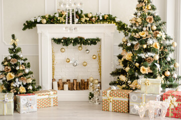 Christmas decorated interior - bright room with fir-tree, gift boxes, fireplace decorated with garlands - New Year celebration photo