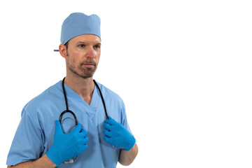 Male surgeon holding stethoscope against white background