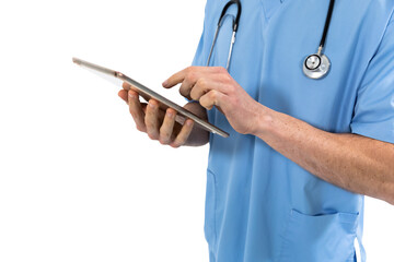 Mid section of male surgeon using digital tablet against white background