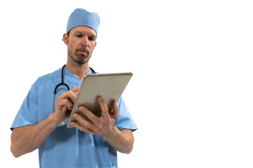 Male surgeon using digital tablet against white background
