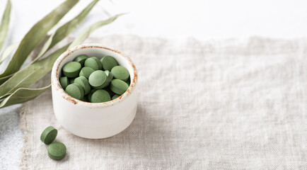 Chlorella pills, concept of superfood and detox, banner © CHZU
