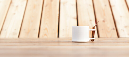 Fototapeta na wymiar White coffee cup on wood. Weiße Tasse auf Holz.