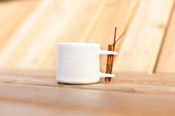 White coffee cup on wood. Weiße Tasse auf Holz.