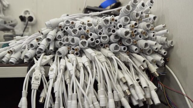 Stack of Connectors and Switches White. Modern Internet Network Switch. Concept of Data Center, Cloud Computing and Telecommunications. White cinch plugs.