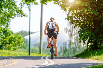 Fototapeta premium Cyclist ride on the bike path in the city Park 